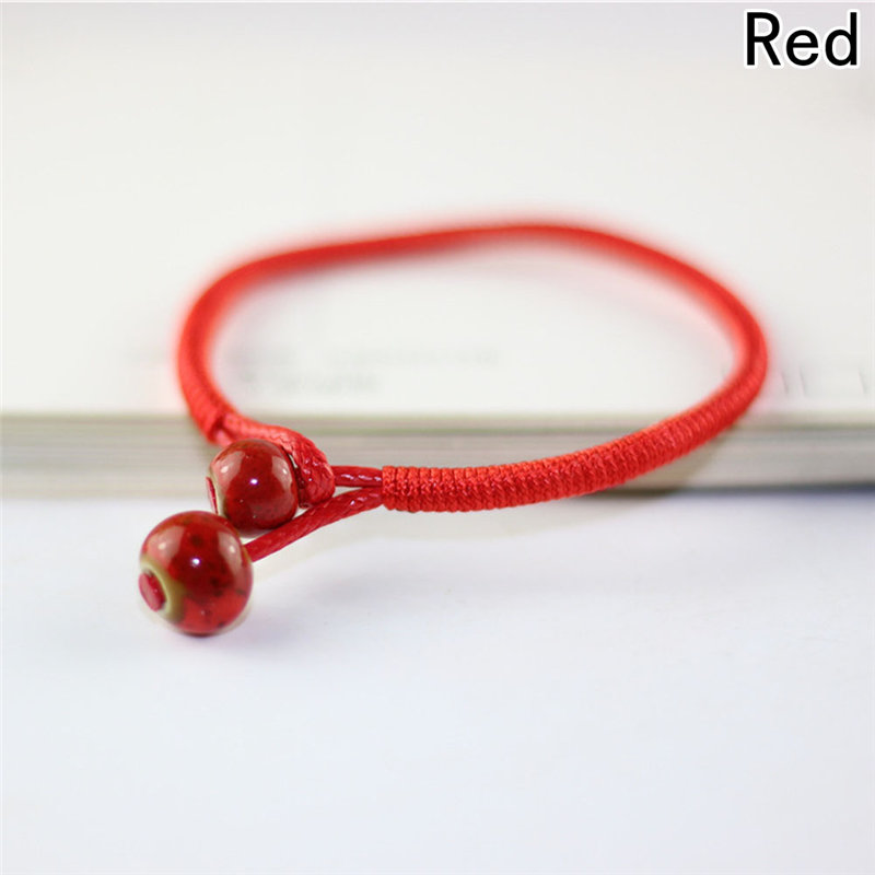 Vòng đeo tay may mắn dây bện màu đỏ mặt tròn kiểu Trung Hoa cho nữ