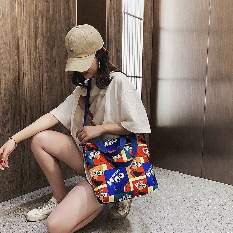 Túi đeo chéo YADOU bằng vải canvas hình Sesame Street đáng yêu phong cách đơn giản thời trang nghệ thuật cho nữ sinh