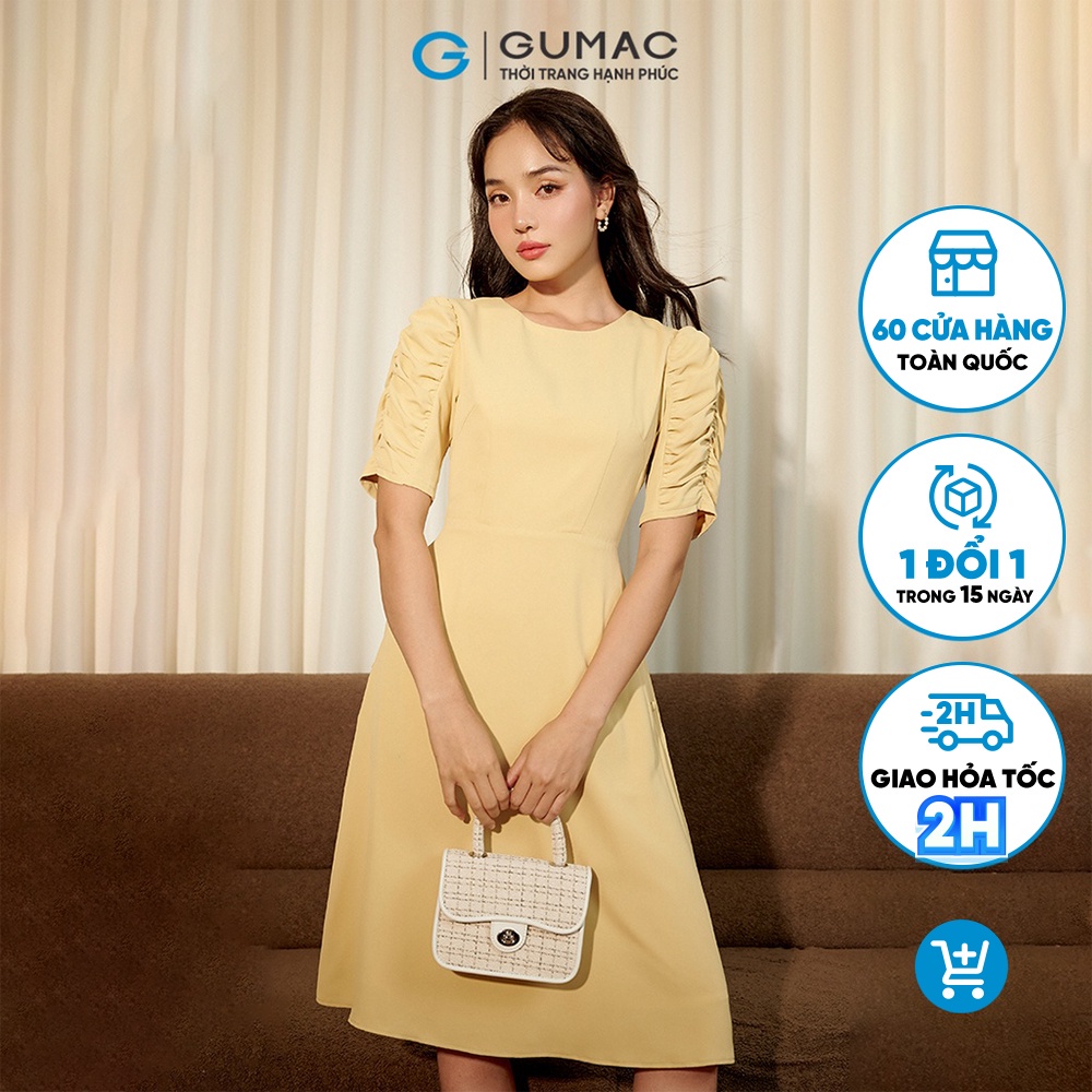 Đầm nữ thời trang GUMAC màu vàng dáng chữ A phối tay nhún DC07050