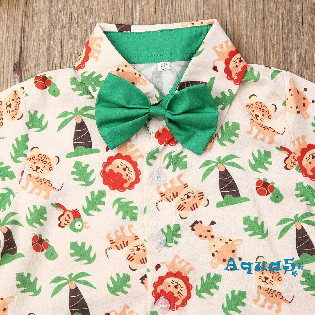 Bộ trang phục 2 mảnh gồm áo sơ mi tay ngắn in hình động vật và quần ngắn màu xanh lá dành cho trẻ em