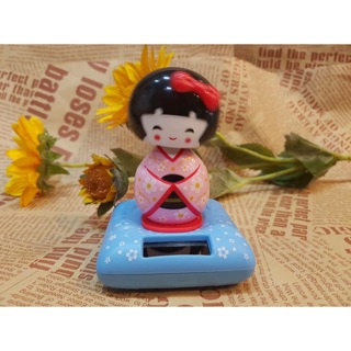 Búp bê kokeshi năng lượng