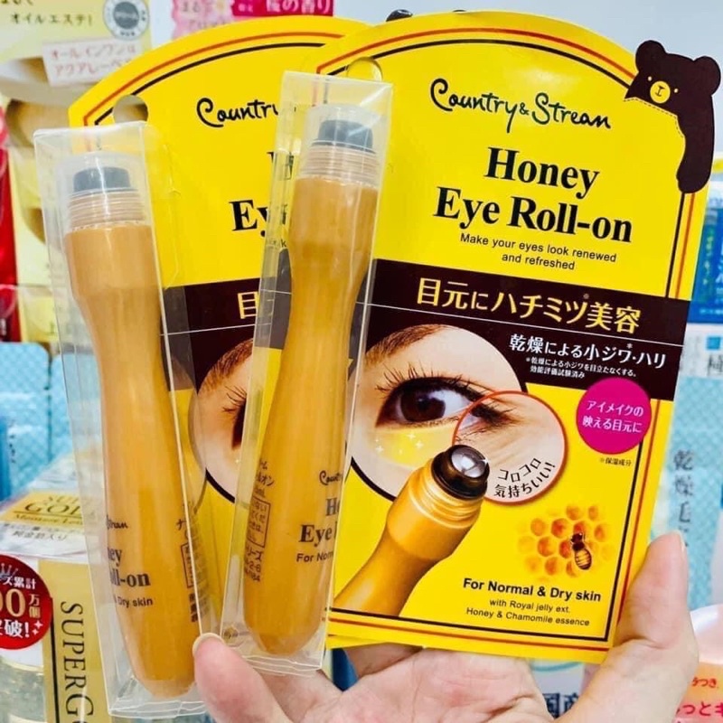 Cây massage lăn mắt honey eye roll-on