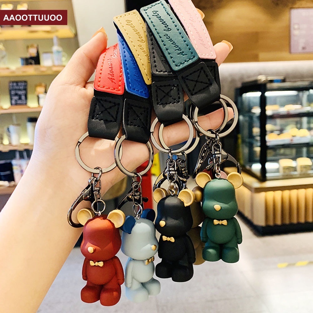Móc khóa xe hơi phối hình chú gấu bằng da đính nơ dễ thương