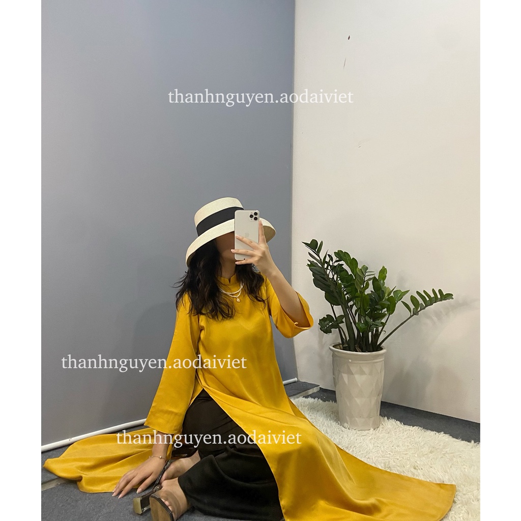 Áo dài vàng cách tân tay loe lụa Ngọc Trai