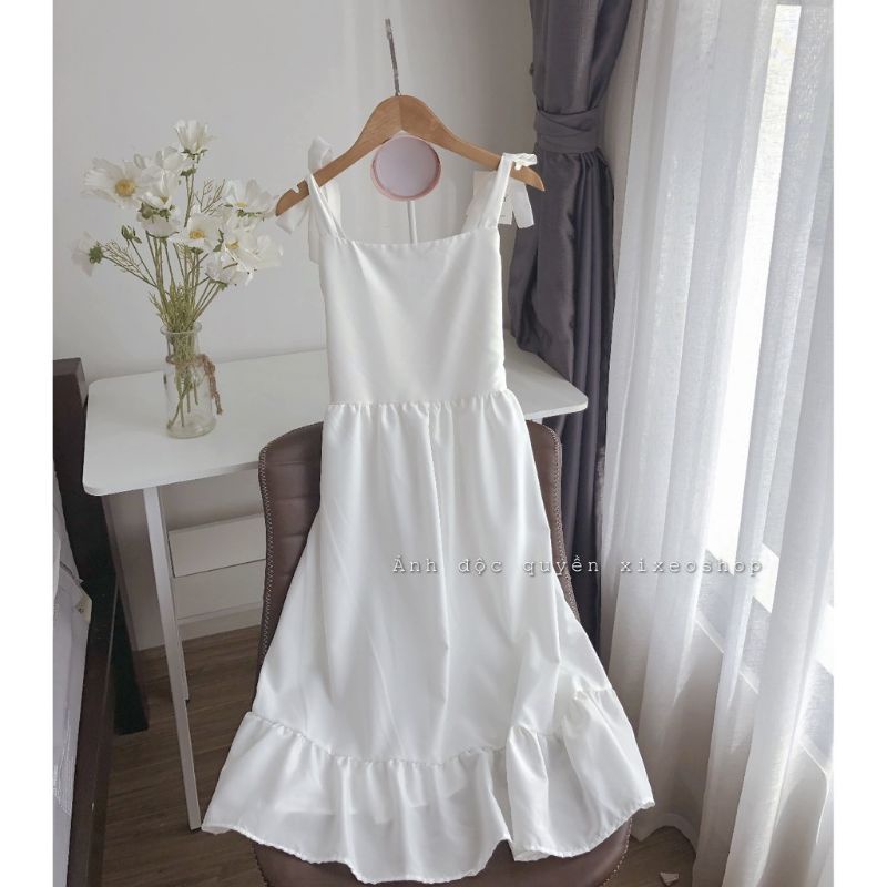 Đầm 2 dây cột nơ vải đũi cao cấp chất mịn và mát.