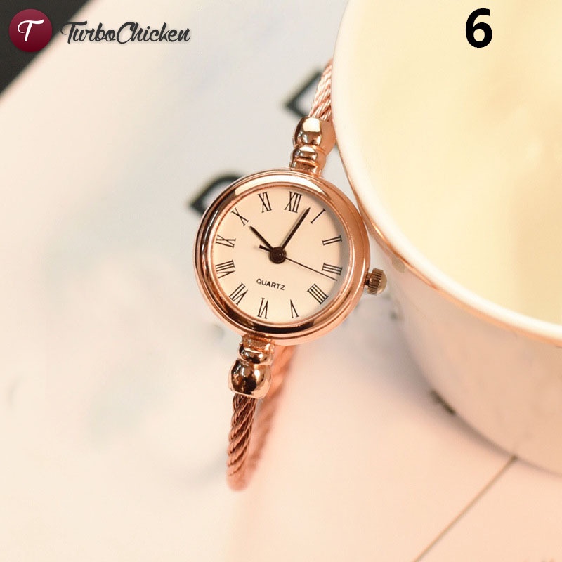 1 đồng hồ đeo tay mặt tròn mini bằng hợp kim phong cách vintage cho nữ