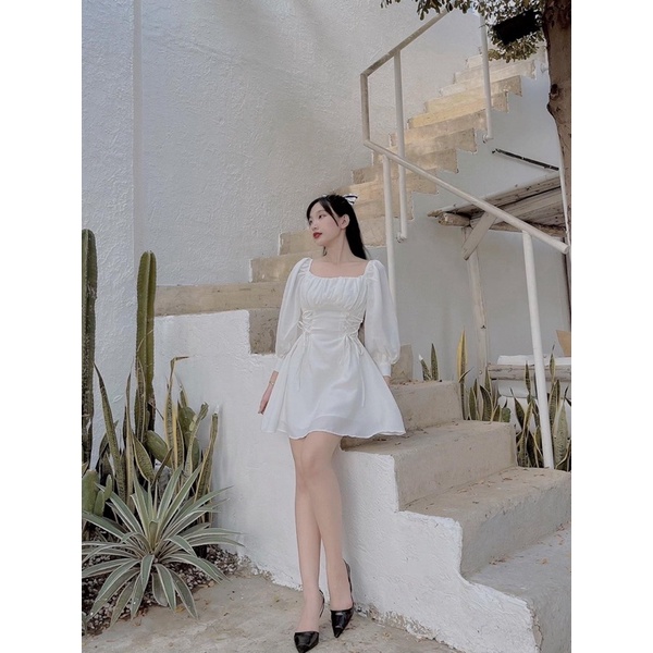 Đầm trắng dài tay đan eo nhíu ngực