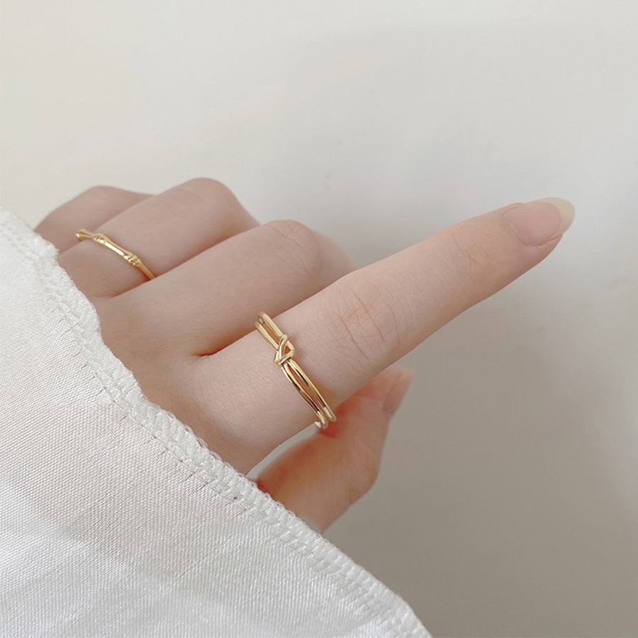Nhẫn hở bằng thép titan màu vàng đồng thiết kế thắt nút đơn giản sáng tạo thời trang cho nữ