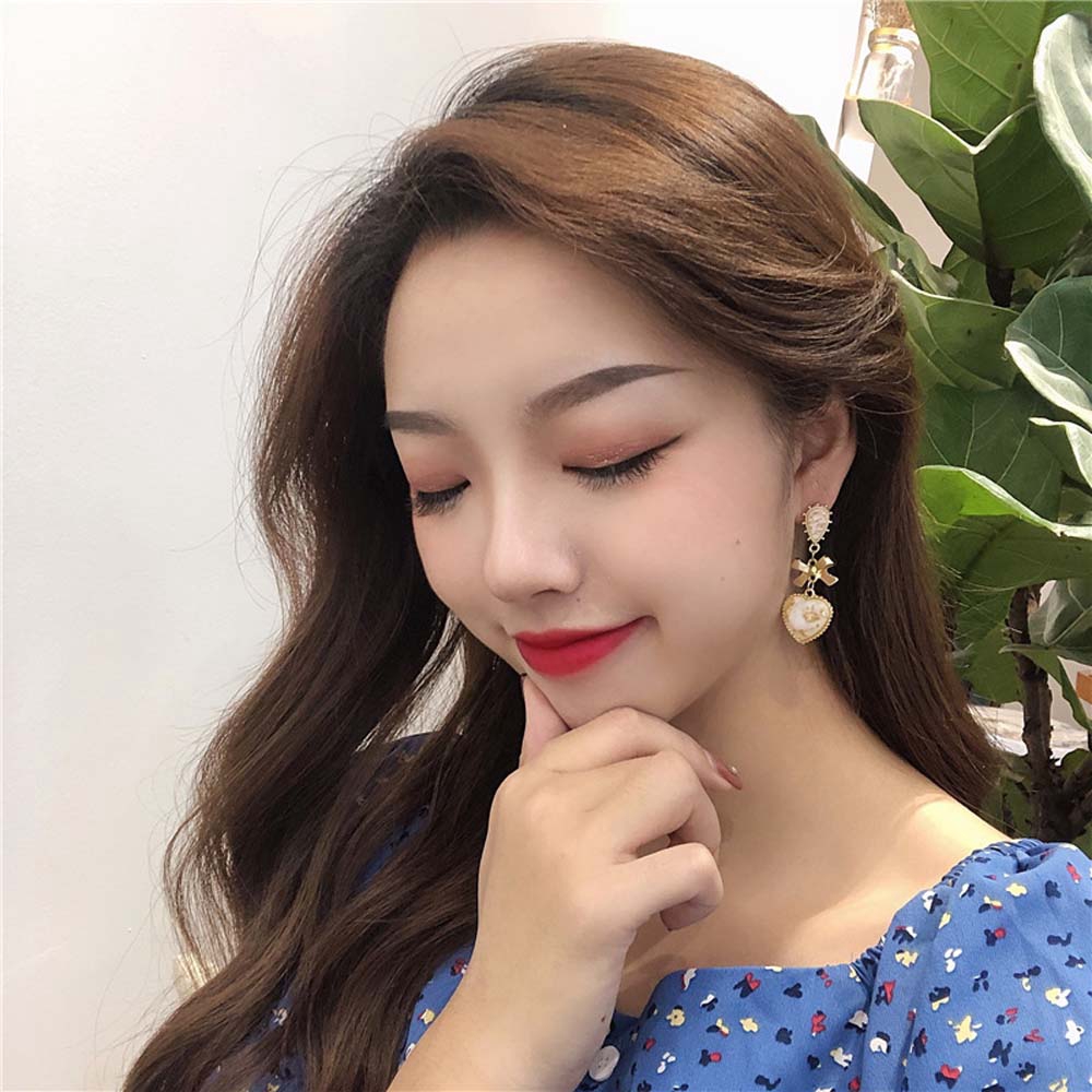Khuyên tai kim loại tráng resin dáng thả hình nơ xinh xắn cho nữ