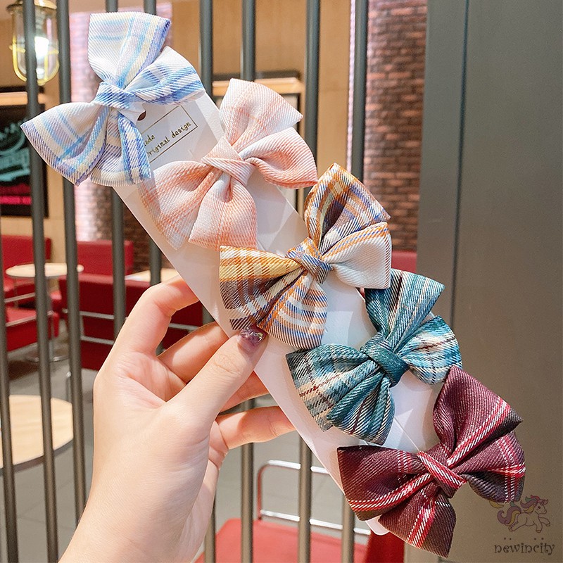Kẹp tóc đính nơ kẻ sọc ca rô xinh xắn dành cho bé gái