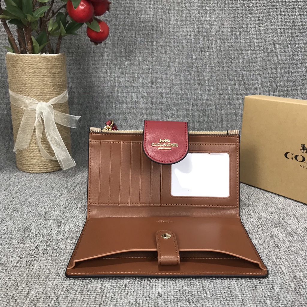Ví clutch nữ cầm tay Coach có dây đeo cổ tay hàng xuất dư xịn có ngăn đựng điện thoại