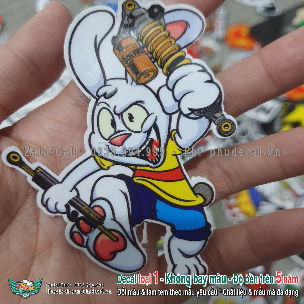 Tem dán sticker hình thỏ cầm phuộc size 6.5x8.3cm dán trang trí xe, điện thoại, nón bảo hiểm và các vật dụng khác