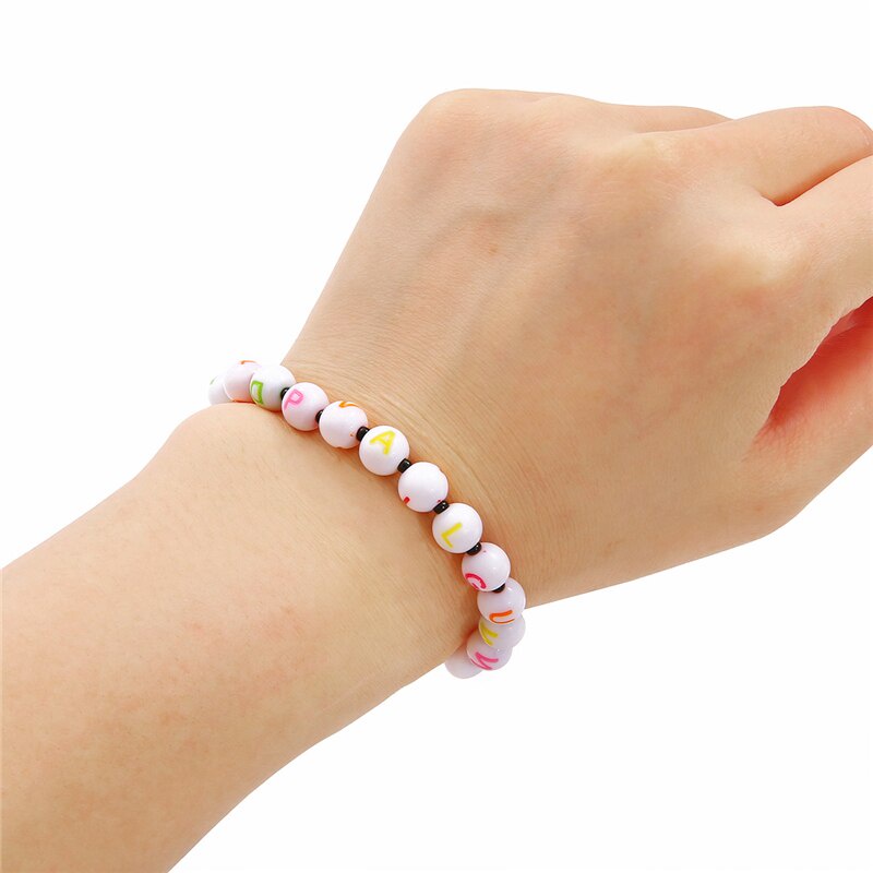 Bộ 100 hạt nhựa acrylic xỏ lỗ hình tròn họa tiết chữ cái dùng làm trang sức