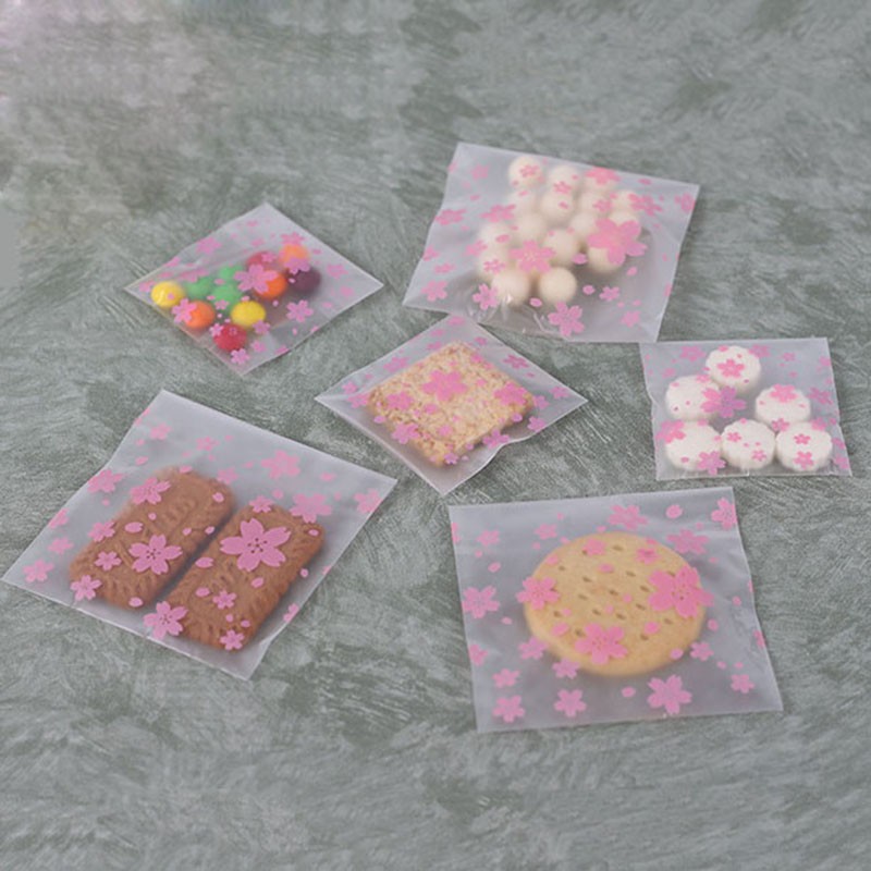 Set 100 túi nhựa đựng bánh quy &amp; kẹo in hình hoa đào có băng dính dán miệng