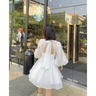 Y hình - đầm xoè trắng tay bồng khoét ngực hở lưng cột nơ