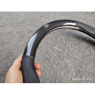 Bọc da vô lăng cacbon có logo MAZDA