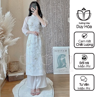 Áo dài cách tân, Áo dài Mita, thiết kế màu trắng, cổ vuông bốn tà đính hạt thủ công
