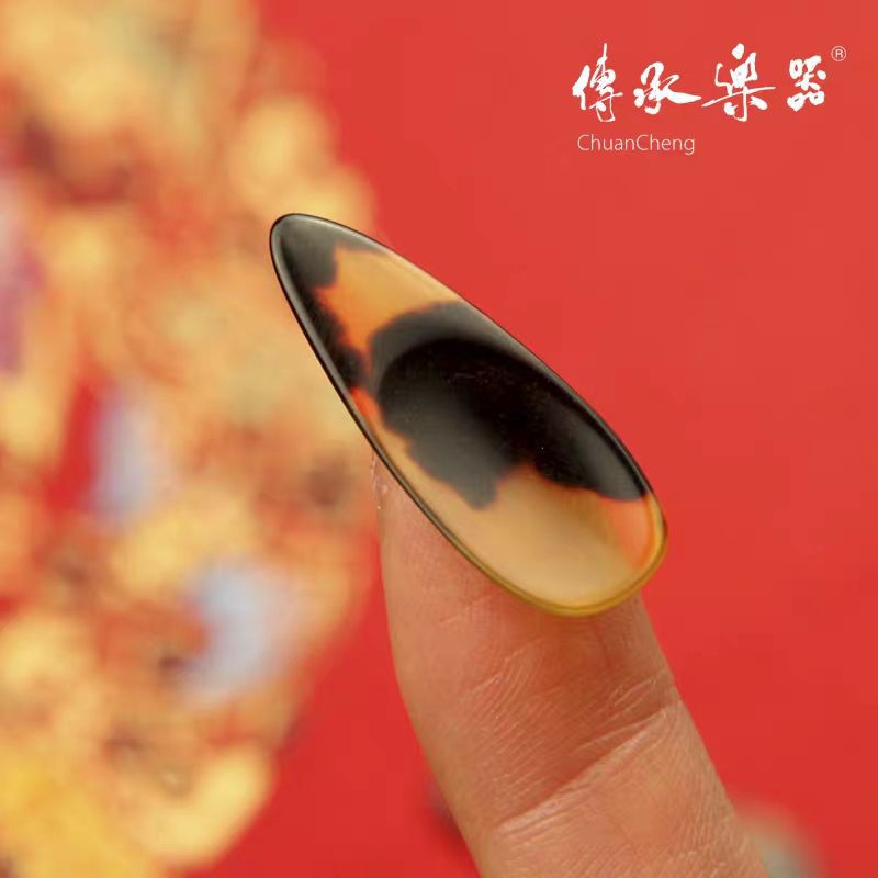 Móng Guzheng lõm, loại tốt. có hộp đựng. Thương hiệu ChuanCheng hành chính hãng. Móng dễ vê . ít tạp âm
