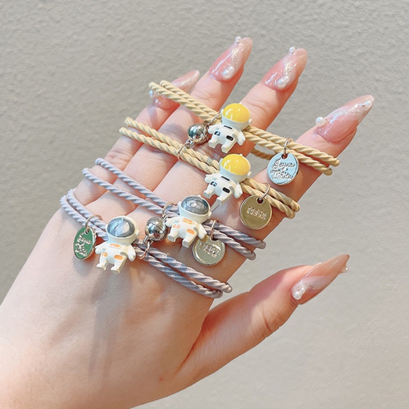 Vòng tay nam châm hình phi hành gia sáng tạo xinh xắn cho cặp đôi