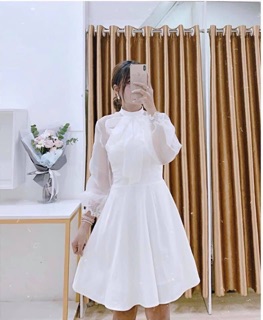 Đầm trắng nơ cổ