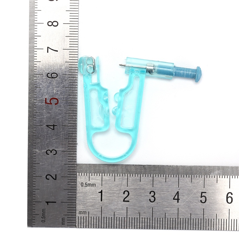 ### 1 Dụng Cụ Xỏ Khuyên An Toàn Không Đau