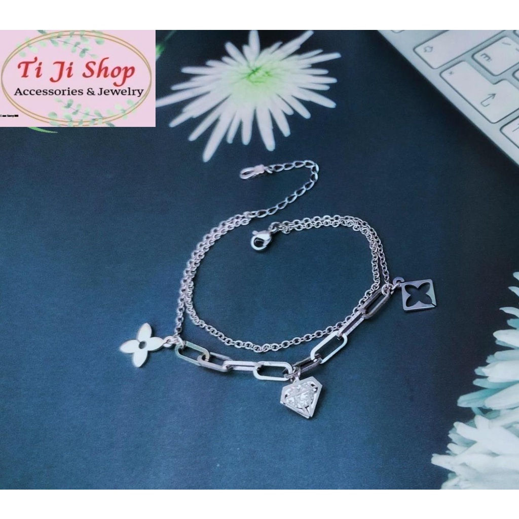 LẮC TAY NỮ INOX 2 TẦNG GẮN PHỤ KIỆN HÌNH KIM CƯƠNG ĐÁ ZICON