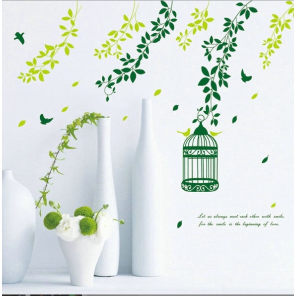 Decal trang trí tường - Những nhành cây xanh bay bay và chiếc lồng chim nhỏ