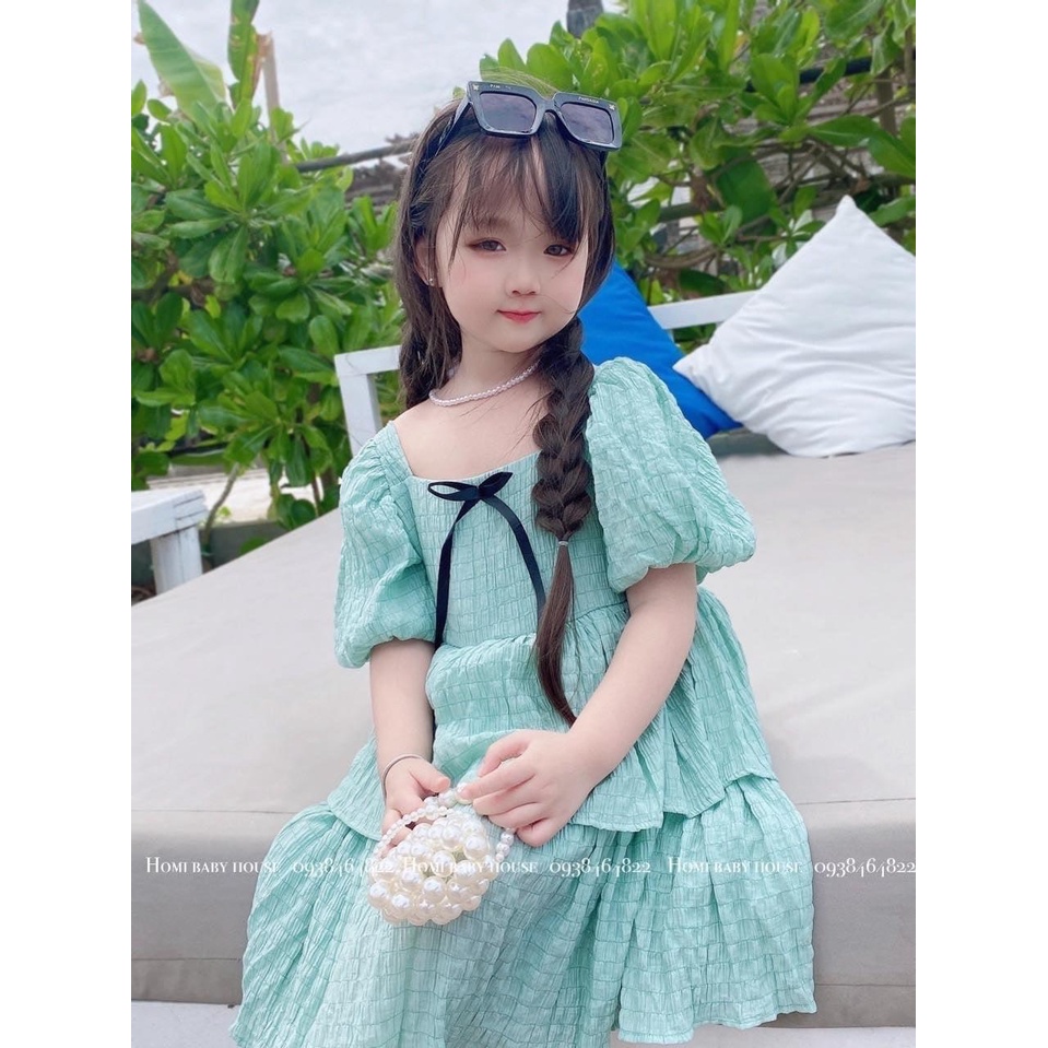 Váy đũi tầng nhăn nơ đen bé gái