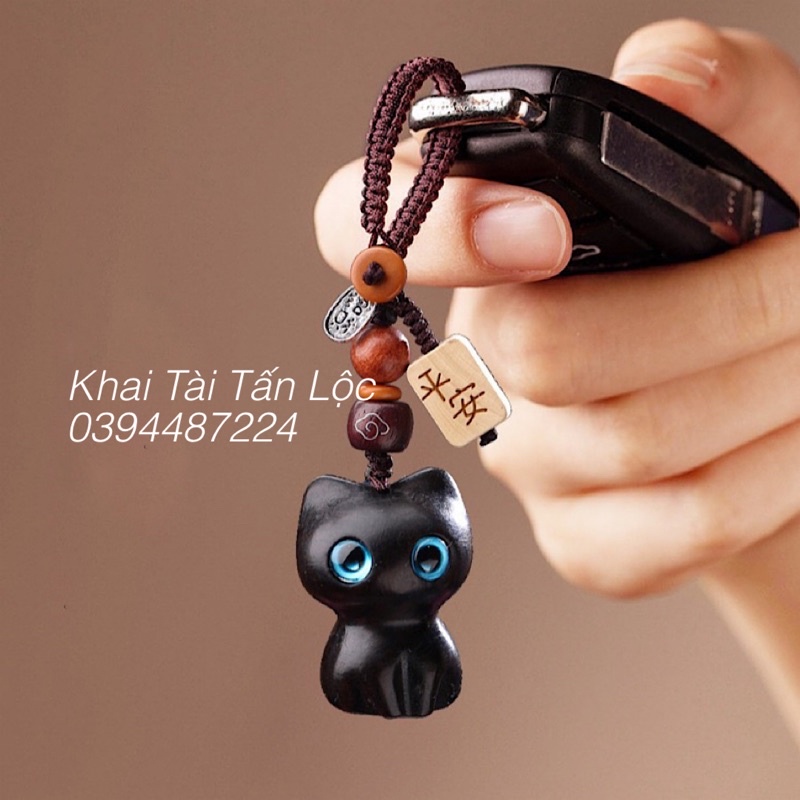Dây treo , móc khoá mèo mun mắt xanh chiêu tài , bình an bằng gỗ mun