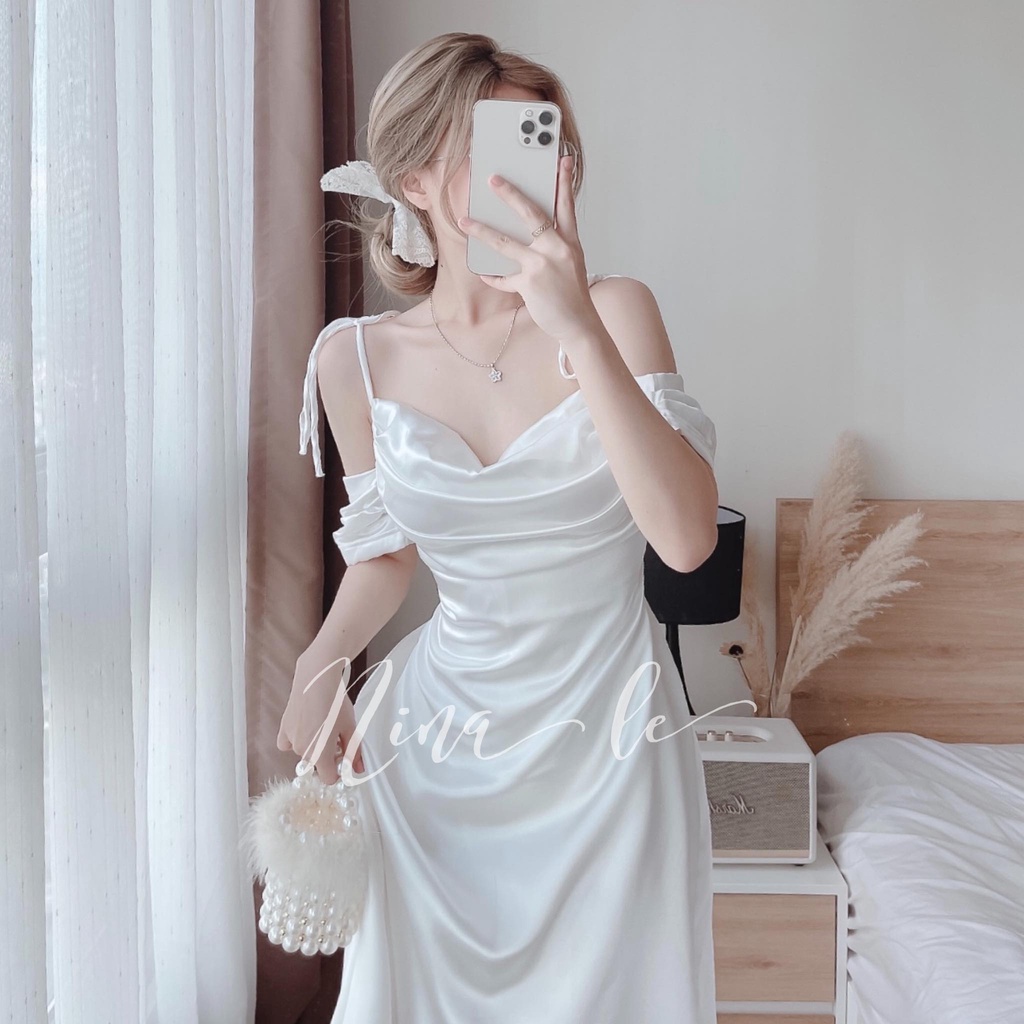 Đầm váy dự tiệc hai dây trễ vai xếp ly ngực màu trắng tinh khôi giúp nàng nổi bật. | BigBuy360 - bigbuy360.vn