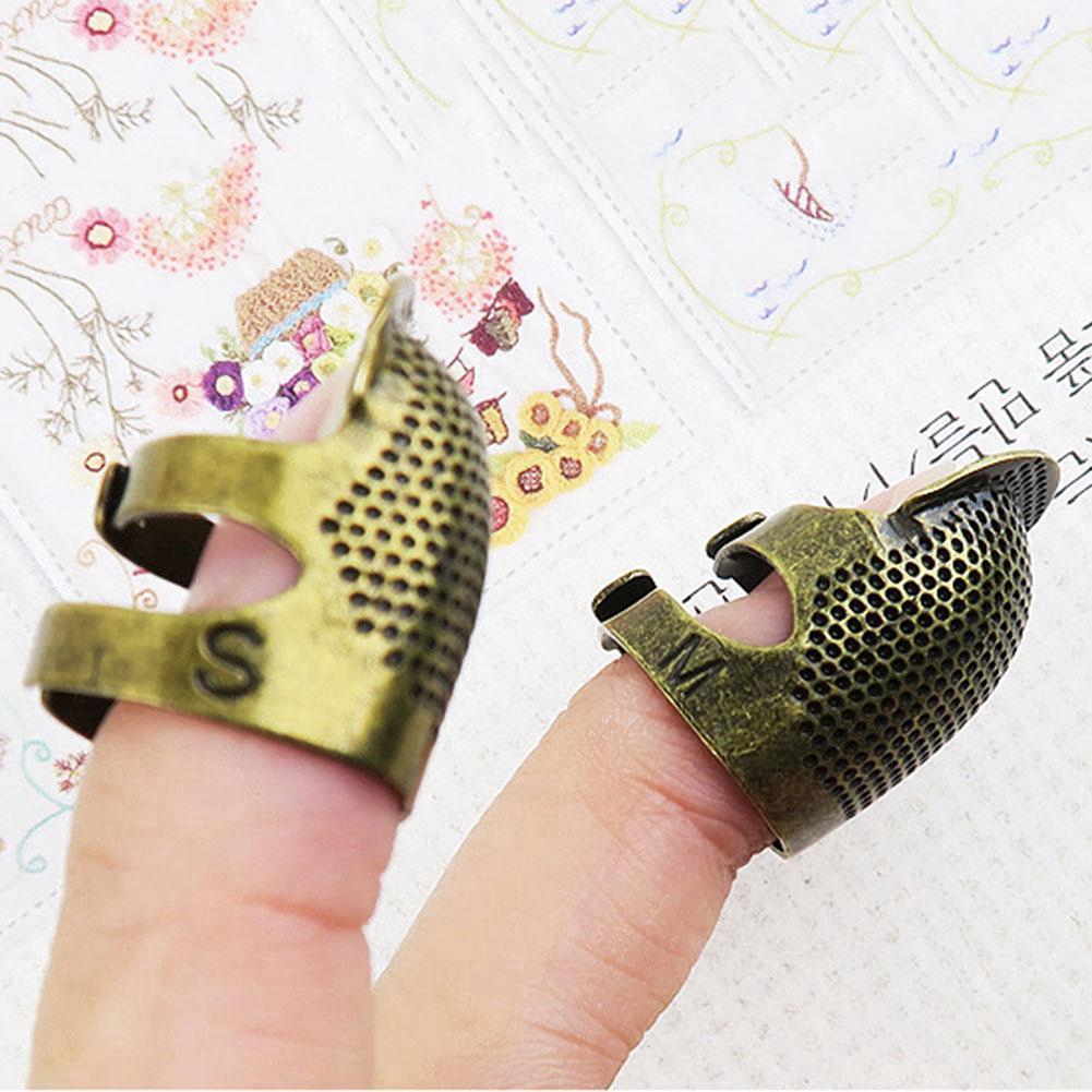 Đế khâu bằng kim loại bảo vệ tay khi may tá E2L3