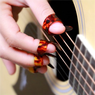 Bộ 4 móng gảy đàn guitar Đàn Guitar