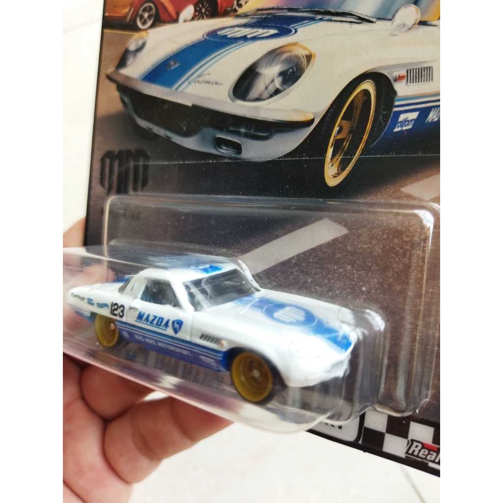 Xe Mô Hình Chính Hãng HotWheels - 1968 Mazda Cosmo Sport - bánh cao su, gầm sắt