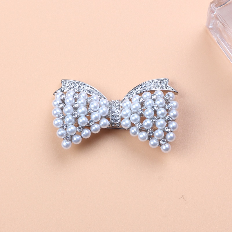 Ghim Cài Áo Hình Nơ Đính Đá Và Ngọc Trai Thiết Kế Sang Trọng