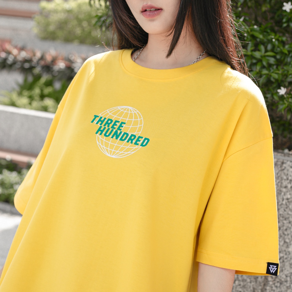 Áo Thun Vàng In Chữ The World Gorgeous Màu Xanh Chất Liệu 100% Cotton Form Rộng Thoải Mái Unisex Nam Nữ