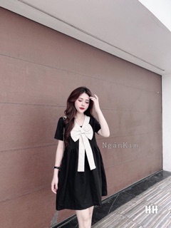 Váy suông nơ ngực trắng cổ V