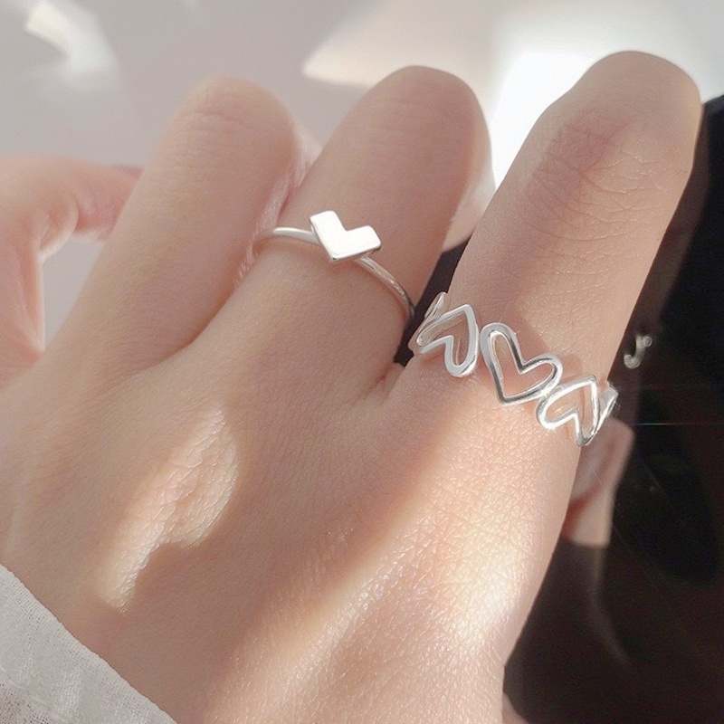 Nhẫn đeo ngón tay dạng hở điều chỉnh kích thước được thiết kế trái tim rỗng hợp kim màu bạc thời trang dành cho nữ