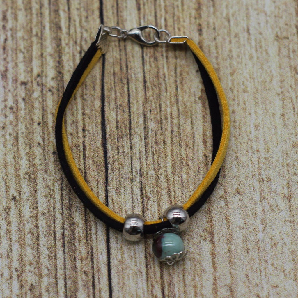 VT60 Vòng tay dây da lộn 5 cái/lốc