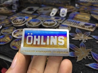 Tem chân phuộc titan chữ Ohlins