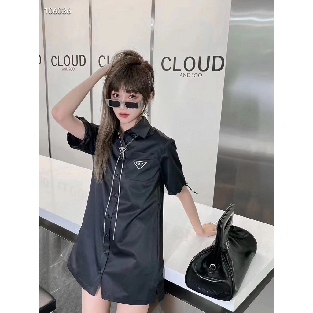 Áo sơ mi nữ thời trang cao cấp Prada với thiết kế basic có túi nắp và dây kèm dây đeo cổ có logo Prada