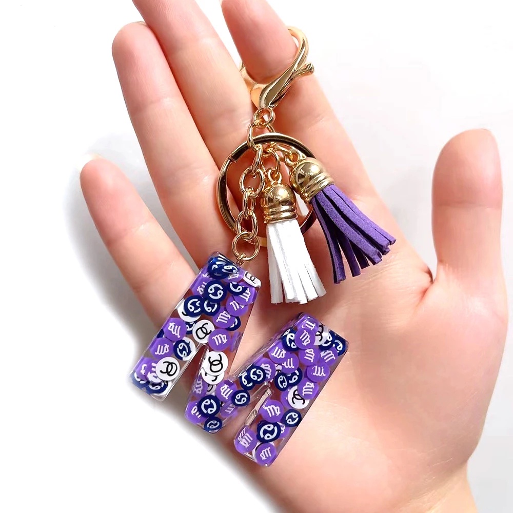 Móc Khóa 26 Chữ Cái Gắn Núm Tua Xinh Xắn Charms