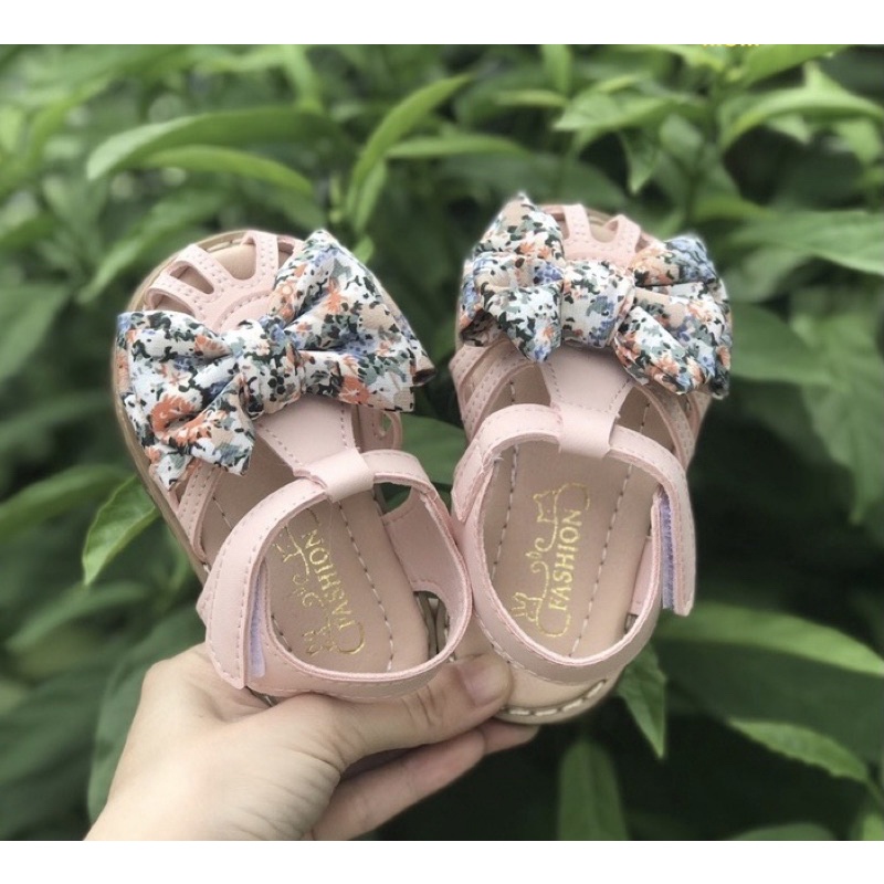 Sandal tập đi cho bé gái - Dép quai hậu rọ cho bé từ 6th có nơ vải hoa nhí xinh xắn điệu đà chống trượt đế dẻo QCCC A2