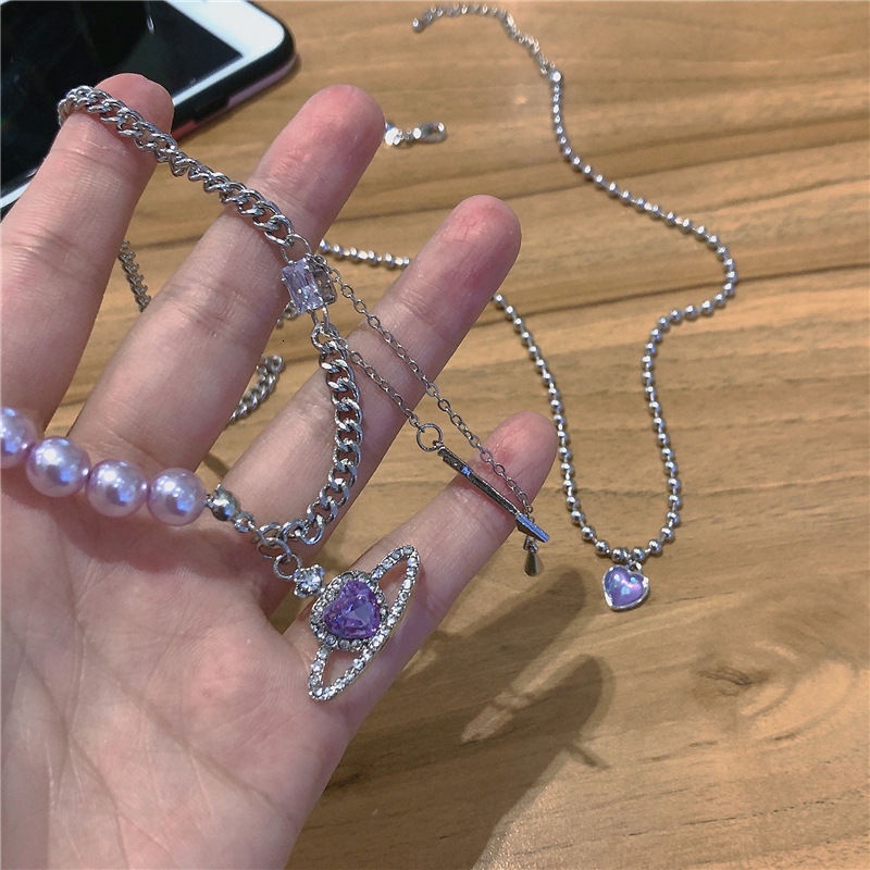 Vòng cổ mặt hình hành tinh trái tim phối ngọc trai giả màu tím 191210