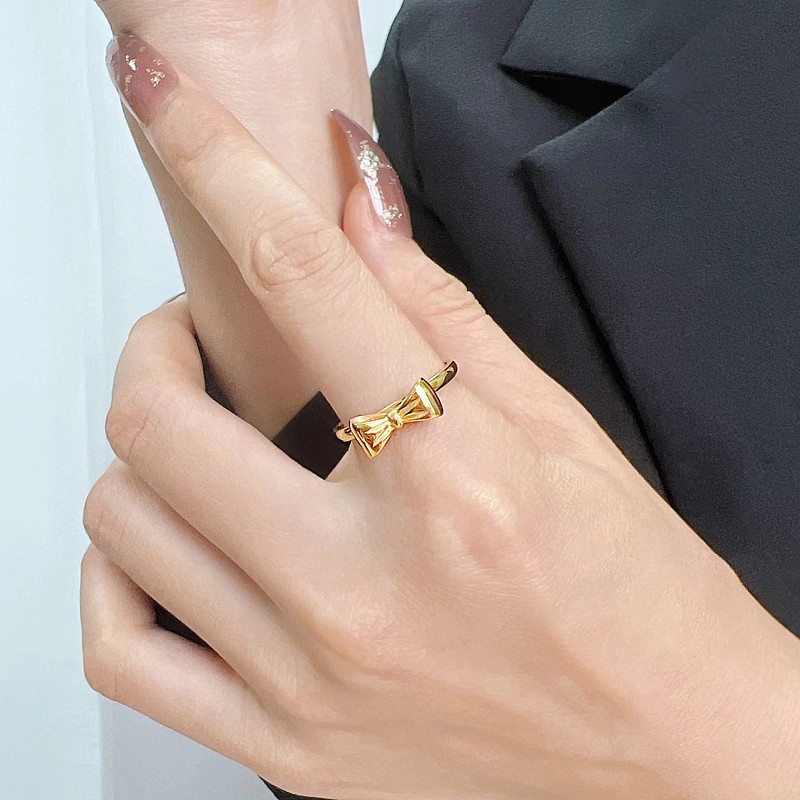 Nhẫn titan không gỉ mạ vàng 18k thiết kế hình chiếc nơ xinh xắn dễ thương dành cho nữ