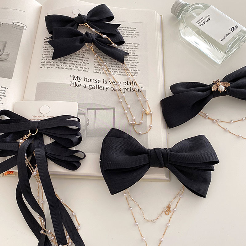 Kẹp tóc hình nơ đính ngọc trai nữ tính thời trang