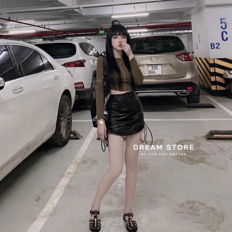 Chân váy da rút dây 2 bên có may kèm quần