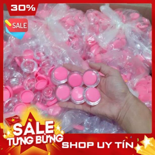 100 hũ đựng mỹ phẩm 3 gram, dạng phi thuyền, hũ trắng trong, nắp hồng, giá 120.000 đồng, sản phẩm không thể thiếu ở spa.