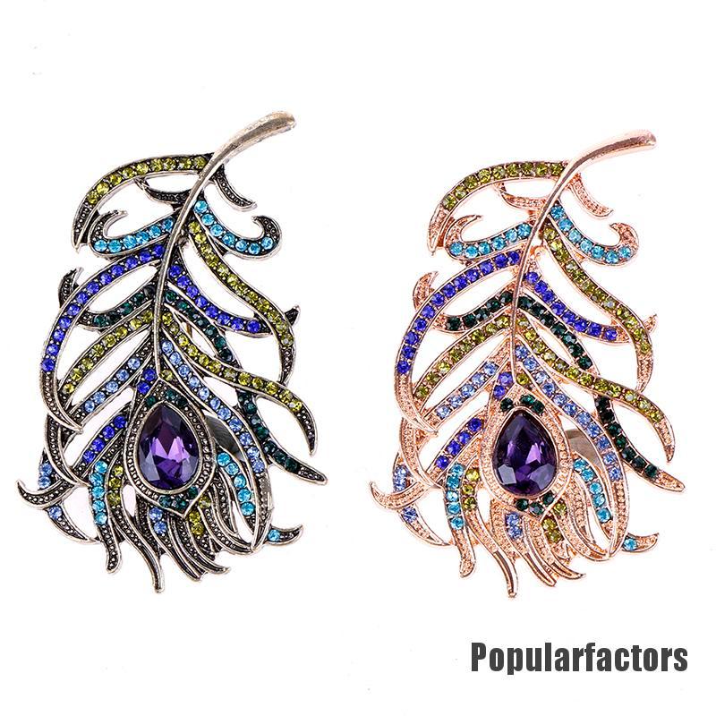 Ghim cài hình lông công đính đá thời trang