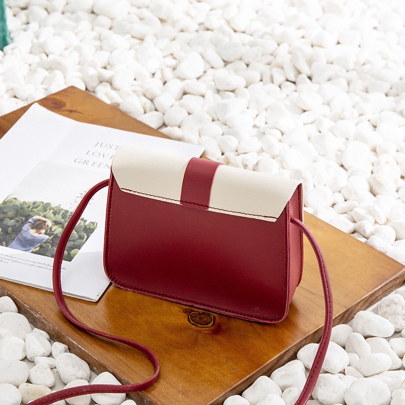 Túi đeo chéo da mềm đính núm tua nữ tính