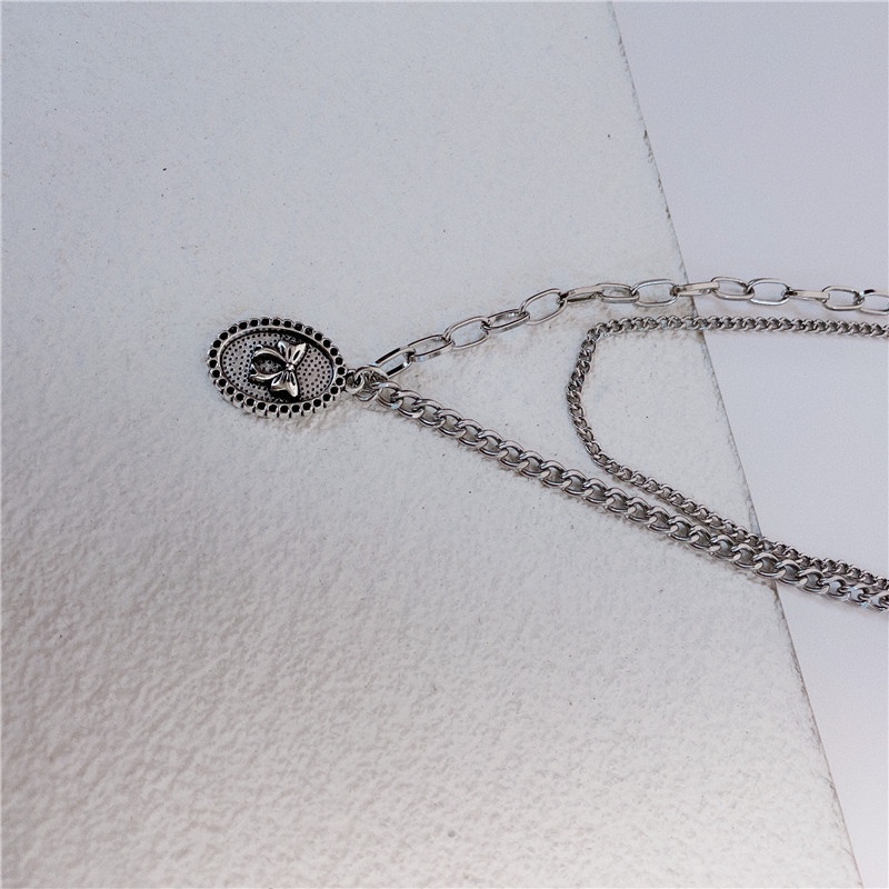 Vòng cổ Dạng Chuỗi Kép Mặt Hình Nơ Màu Bạc Phong Cách Punk Hiphop Thời Trang